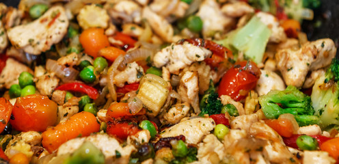 turkey meat stew with fresh vegetables cooked in a wok pan
