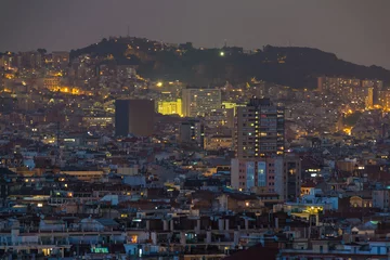 Fotobehang Aerial view of the illuminated Barcelona city at twilight, Spain © dr_verner