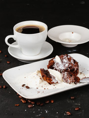 Dessert with hot chocolate muffin and ice cream on a black background.