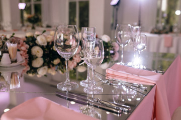 Restaurant table with glasses, napkins and cutlery