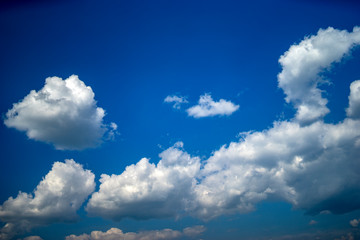 Naklejka na ściany i meble Clouds in the sky with bright sun