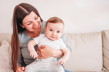 Charming little baby boy 6 months with mother, copy space