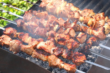 Barbecue skewers with juicy appetizing delicious meat closeup
