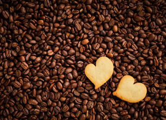 Roasted coffee bean background with fresh pastries