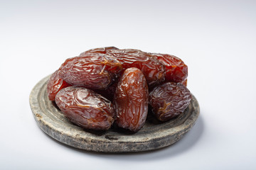 Pile of sweet tasty dried dates fruits close up isolated