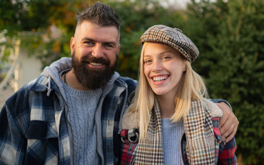 They have own style. Lumberjack style. Couple wear checkered clothes nature background. Man bearded...