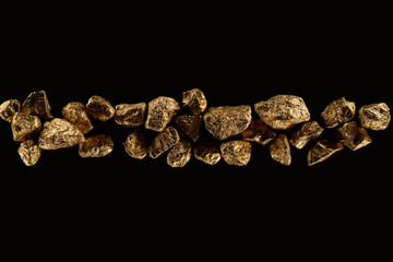 top view of golden textured stones arranged in row isolated on black