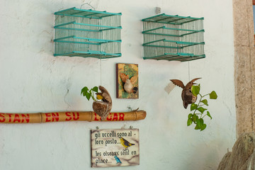 Objects depicting a message of freedom for caged birds