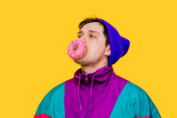 Funny style white man in 90s jacket and hat with donut on yellow background
