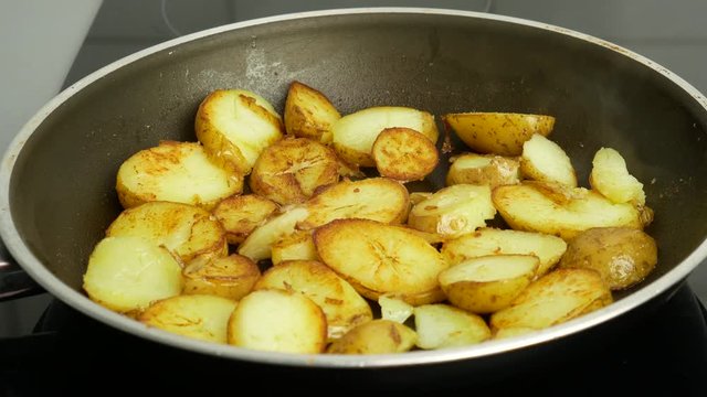 Close up. Potatoes in a frying pan fried in butter. Food concept