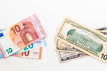 Fototapeta na wymiar American Dollar and Euro Banknotes isolated on white background.