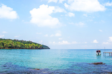 Ocean view crystal clear water from Haad Sai Daeng Beach which has wooden bridge for transfer tourists on Koh Kood island, Trat Thailand.