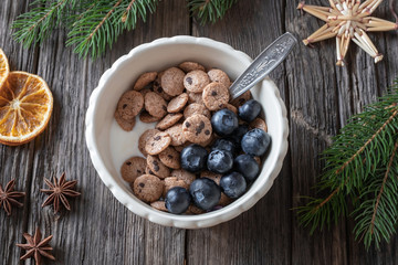 Breakfast cereals with Christmas decoration, top view