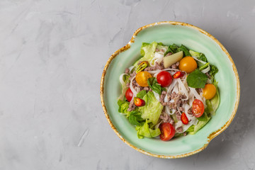 Spicy Thai salad with ground beef and rice noodles. The view from the top. Copy-space