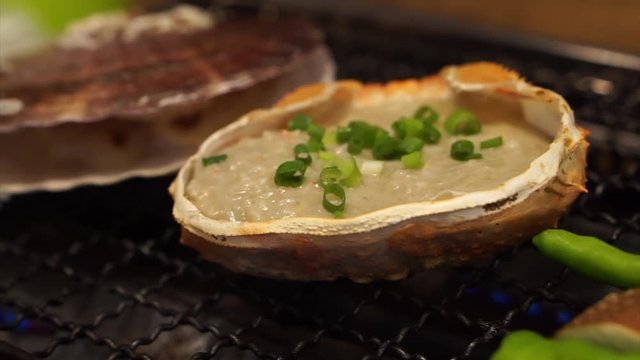 Japanese kani miso in crab shell and scallop bbq in restaurant