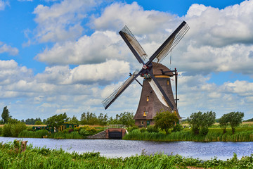 Netherlands rural lanscape with windmills at famous tourist site Kinderdijk in Holland. Old Dutch village Kinderdijk, UNESCO world heritage site. 