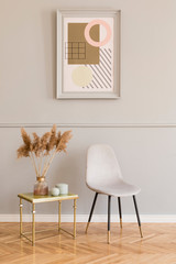 Minimalistic and luxury living room of apartment interior with elegant marble table, gray velvet...