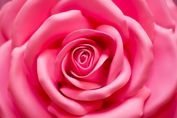 Fototapeta na wymiar Pink artificial rose large. Rose flower background