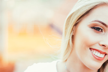 Fototapeta premium Portrait of a beautiful, blonde, happy and smiling woman. Photo with space for text