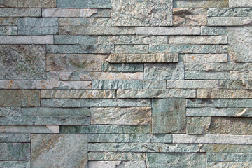 Background, texture, laying of natural stone and blocks of pastel shades.