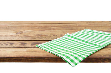 Brown old vintage wooden table with framed checkered tablecloth isolated on white. Thanksgiving day and Cristmas table concept. Top view and copy space. Selective focus