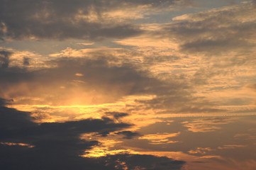 Dramatic sunset sky background with fiery clouds