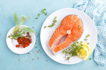 Fresh raw salmon fish steak with ingredients for cooking