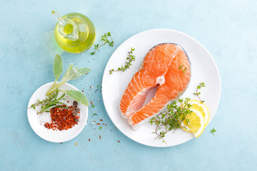 Fresh raw salmon fish steak with ingredients for cooking