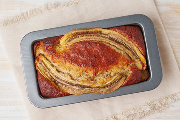 Banana bread in a pan. Cake with banana, chocolate, walnut. Traditional american cuisine