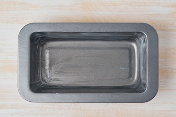 Oil greased baking dish, bread loaf pan with butter. Step by step recipe for Banana bread