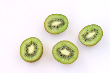 Kiwi halves are located on a white background