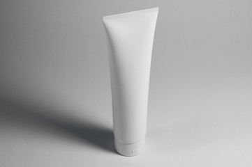 white cosmetic tube for creams