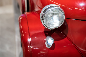 Rear light of a red retro car - obrazy, fototapety, plakaty