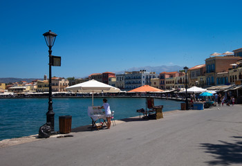 Fototapeta na wymiar Walking through the streets of the old town of Chania. Greek resort.