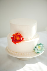 small white wedding cake with sugar flowers