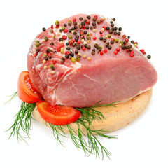 Meat tenderloin on cutting board isolated on white background.