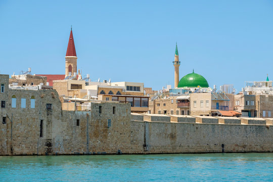 Israel, North District, Upper Galilee, Acre (Akko). Al-Jazzar Mosque and buildings in the old town from Akko harbor.