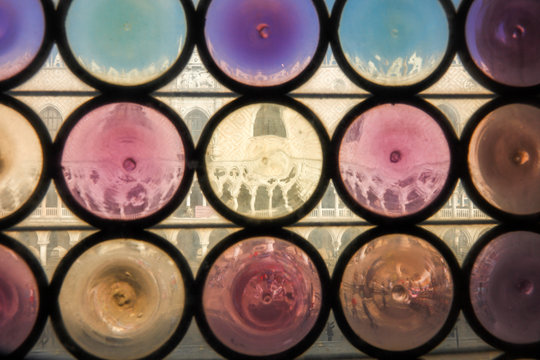 Looking through the old windows of the Marciana library's to the Doge's Palace, Piazzetta San Marco,Venice, Veneto, Italy, Europe.