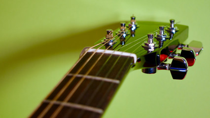 guitar headstock with tuning pegs . color background