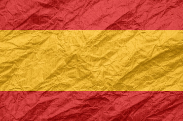 Spain flag on old crumpled craft paper.