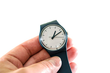 women's wrist watches in hand on a white background. Close-up