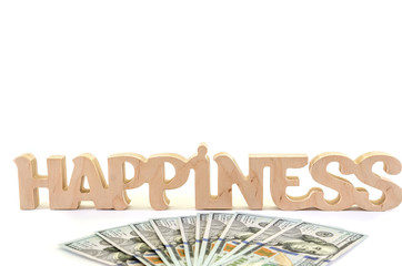 Wooden word "happiness" with dollars on white background