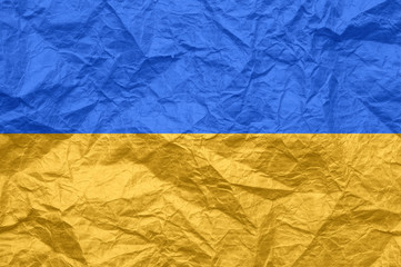 Ukraine flag on old crumpled craft paper.