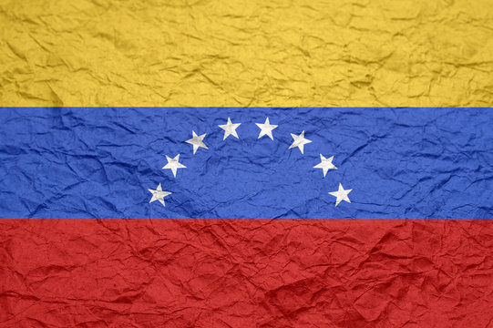 Venezuela flag on old crumpled craft paper.