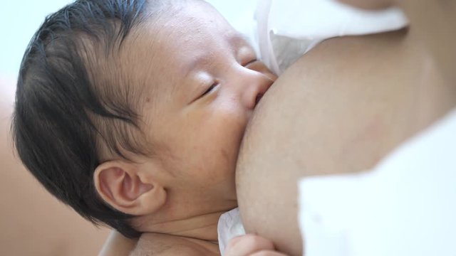Asian newborn with young mother 