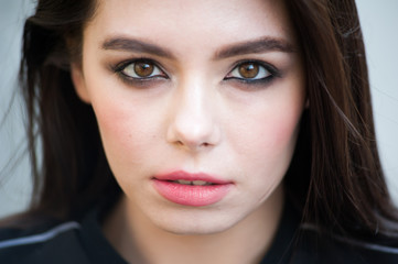 Fototapeta premium Close up portrait of beautiful young brunette woman 