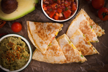 Mexican quesadilla, tortilla filled with cheese, meat and vegetables