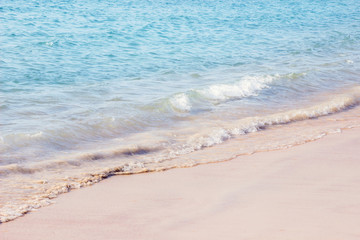 seascape of wave splash on white sand beach 
