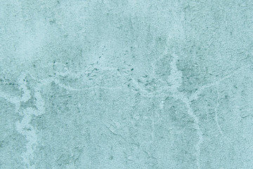 Fototapeta na wymiar Turquoise cracked wall background