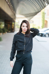 Beautiful smiling young woman wearing black jacket